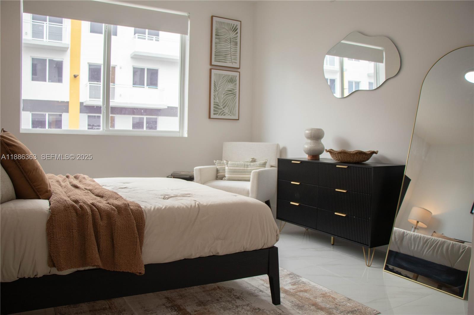 1451 West 29th Street, Unit 206 Hialeah, FL 33012 - Photo 4 of 19 a bedroom with a bed and a window