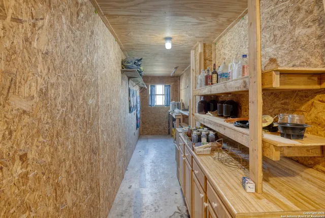 a view of empty room with storage