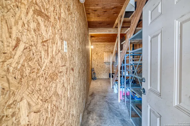 a view of a garage with parked cars