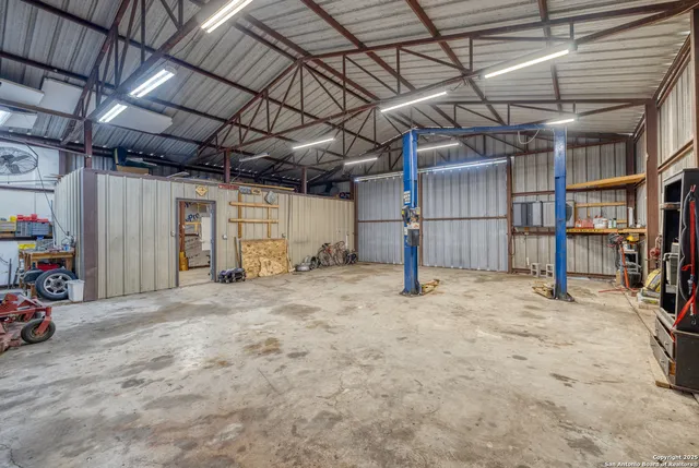 a small pool with some plants in the background