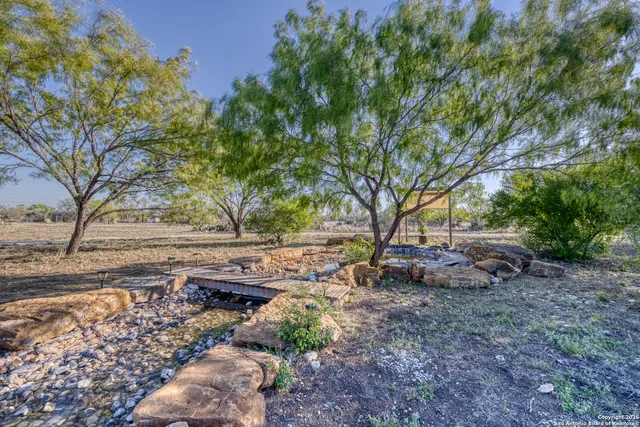a view of swimming pool with a yard