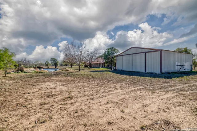 a view of a large trees in front of a house