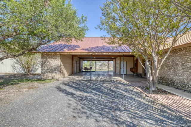 a view of kitchen with refrigerator cabinets and outdoor view