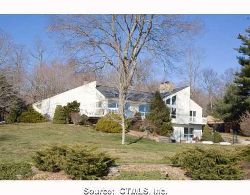 165 Ayers Point Road Old Saybrook, CT 06475 - Photo 1 of 1 a view of a big house with a big yard and large tree