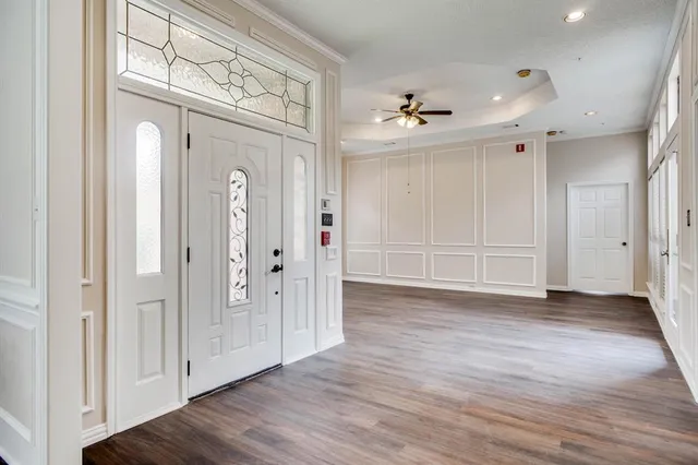 wooden floor with white walls