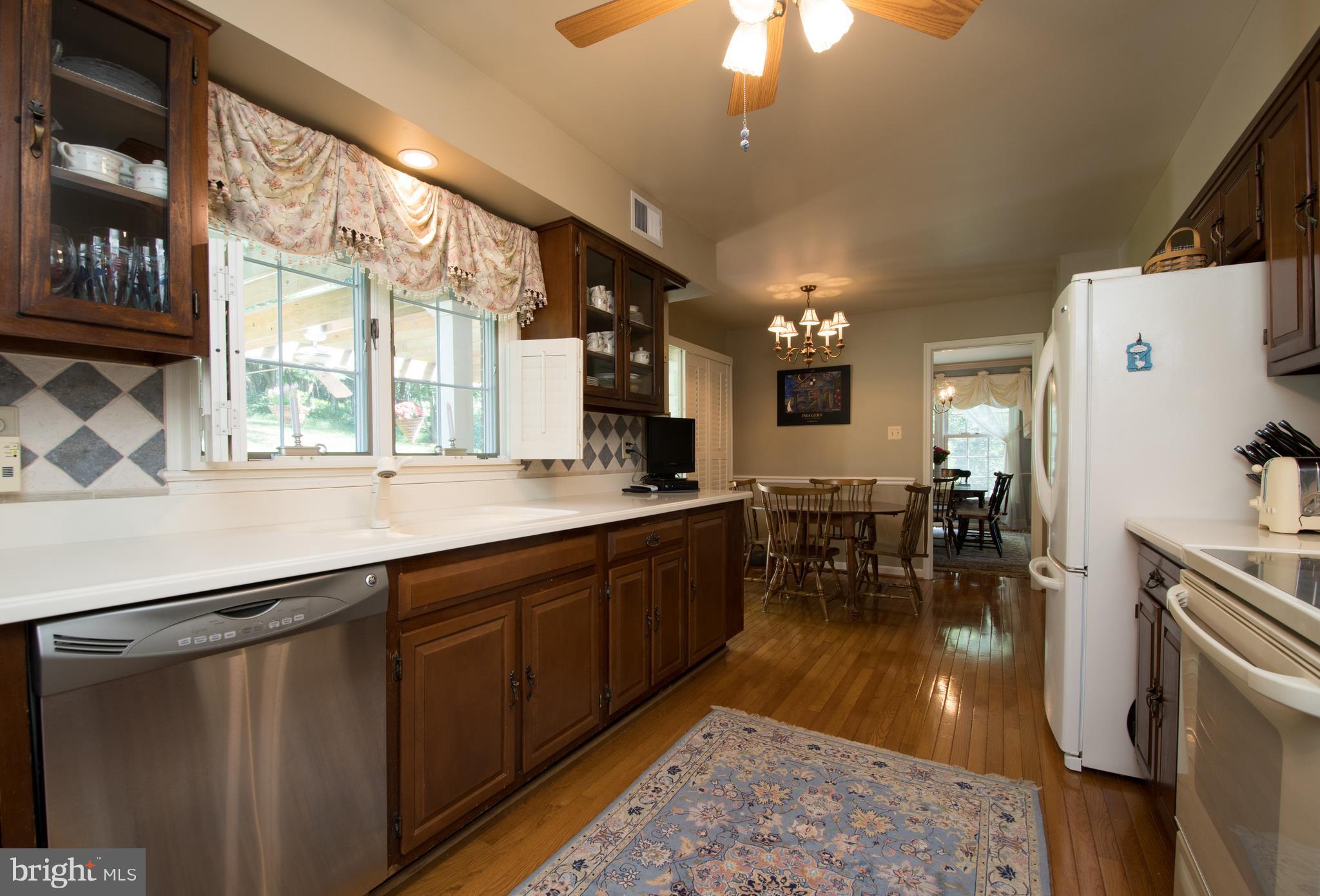 Hardwood also in kitchen! Corian countertops.
