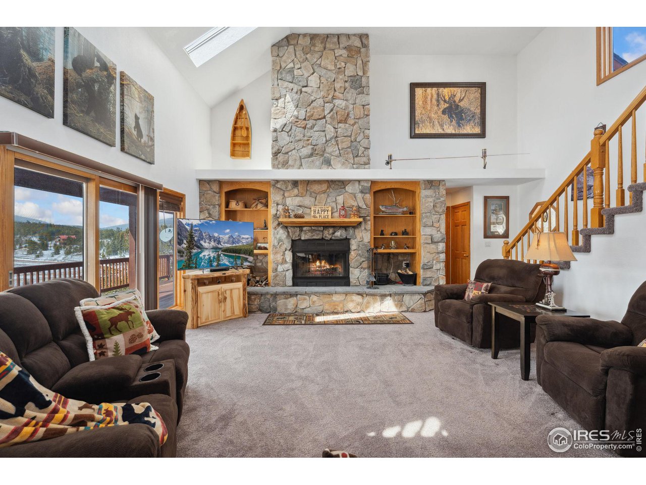 873 Huron Road Red Feather Lakes, CO 80545 - Photo 3 of 40 Cozy great room with stone fireplace