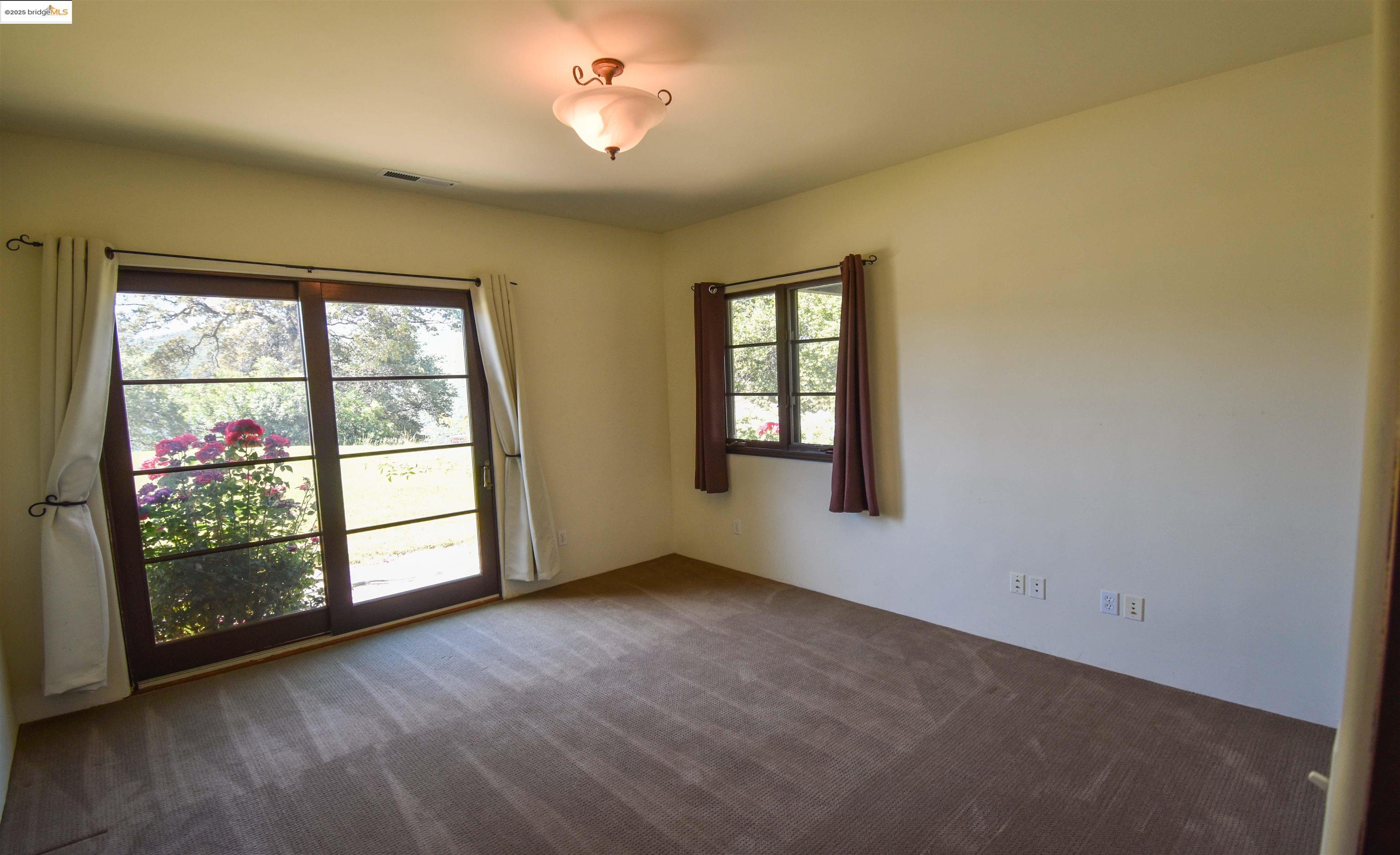 26255 Powell Ranch Road Sonora, CA 95370 - Photo 17 of 48 an empty room with windows