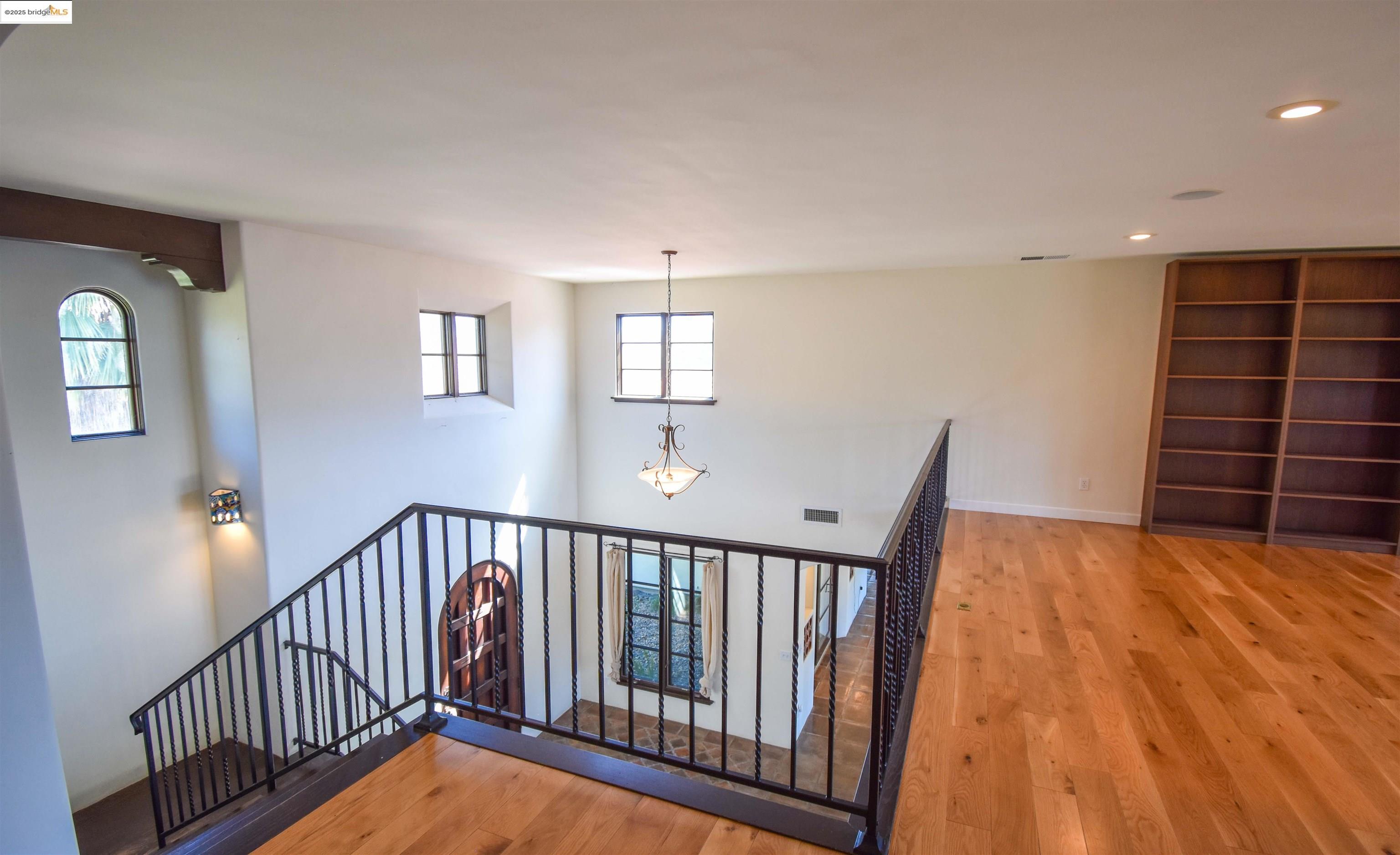 26255 Powell Ranch Road Sonora, CA 95370 - Photo 19 of 48 a view of a hallway with closet and wooden floor