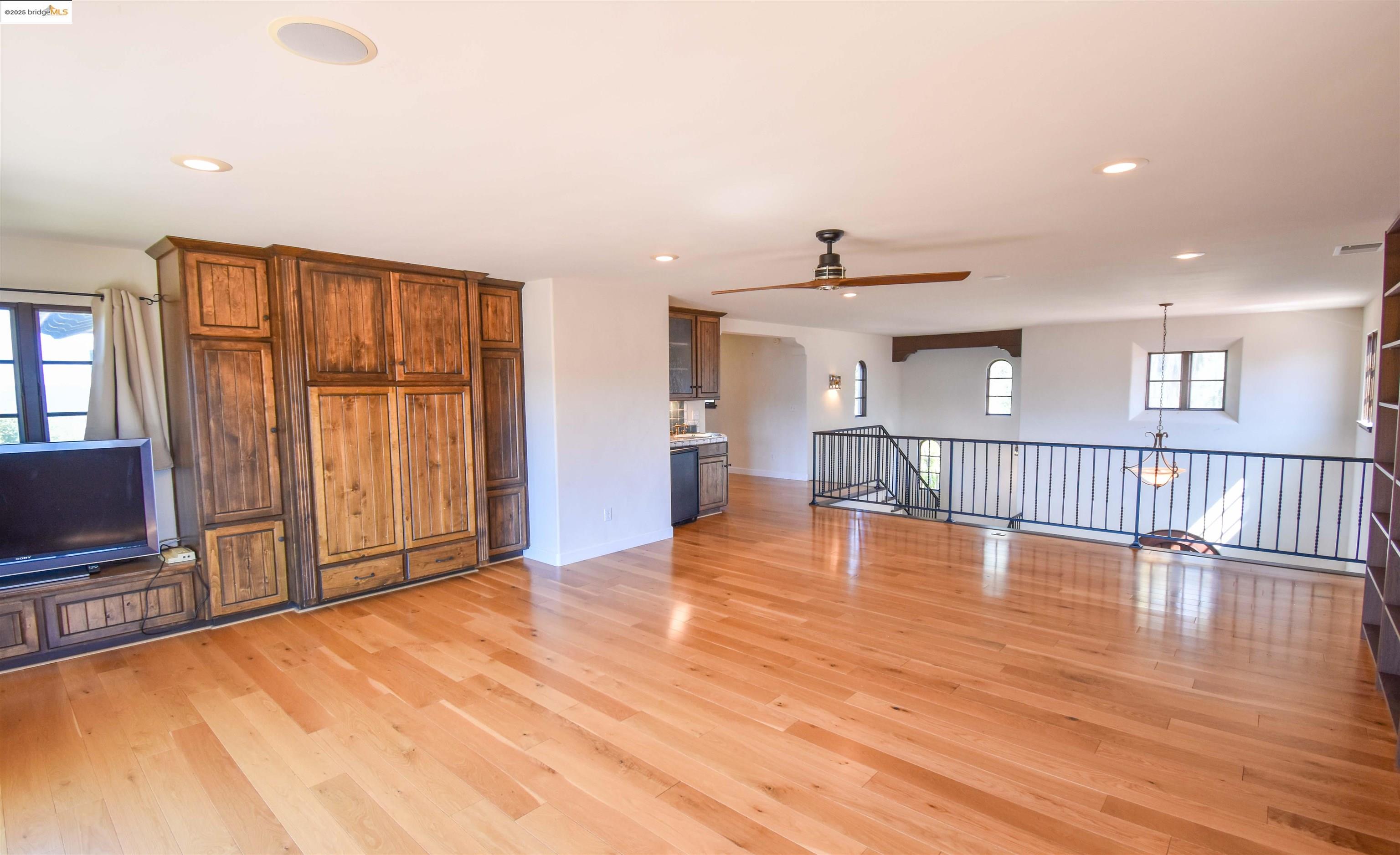 26255 Powell Ranch Road Sonora, CA 95370 - Photo 21 of 48 a view of an empty room with wooden floor and a window