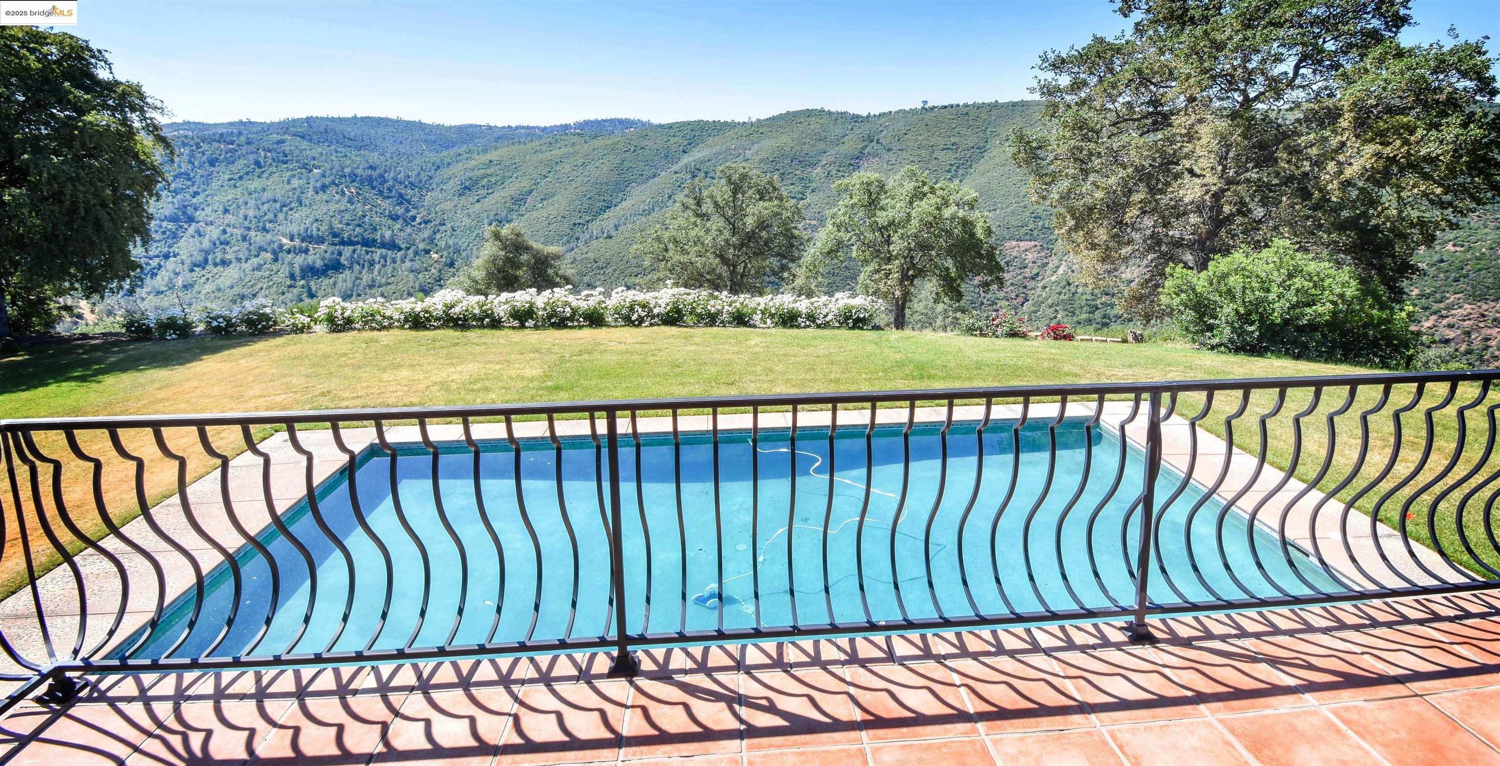 26255 Powell Ranch Road Sonora, CA 95370 - Photo 23 of 48 a view of a balcony with a garden