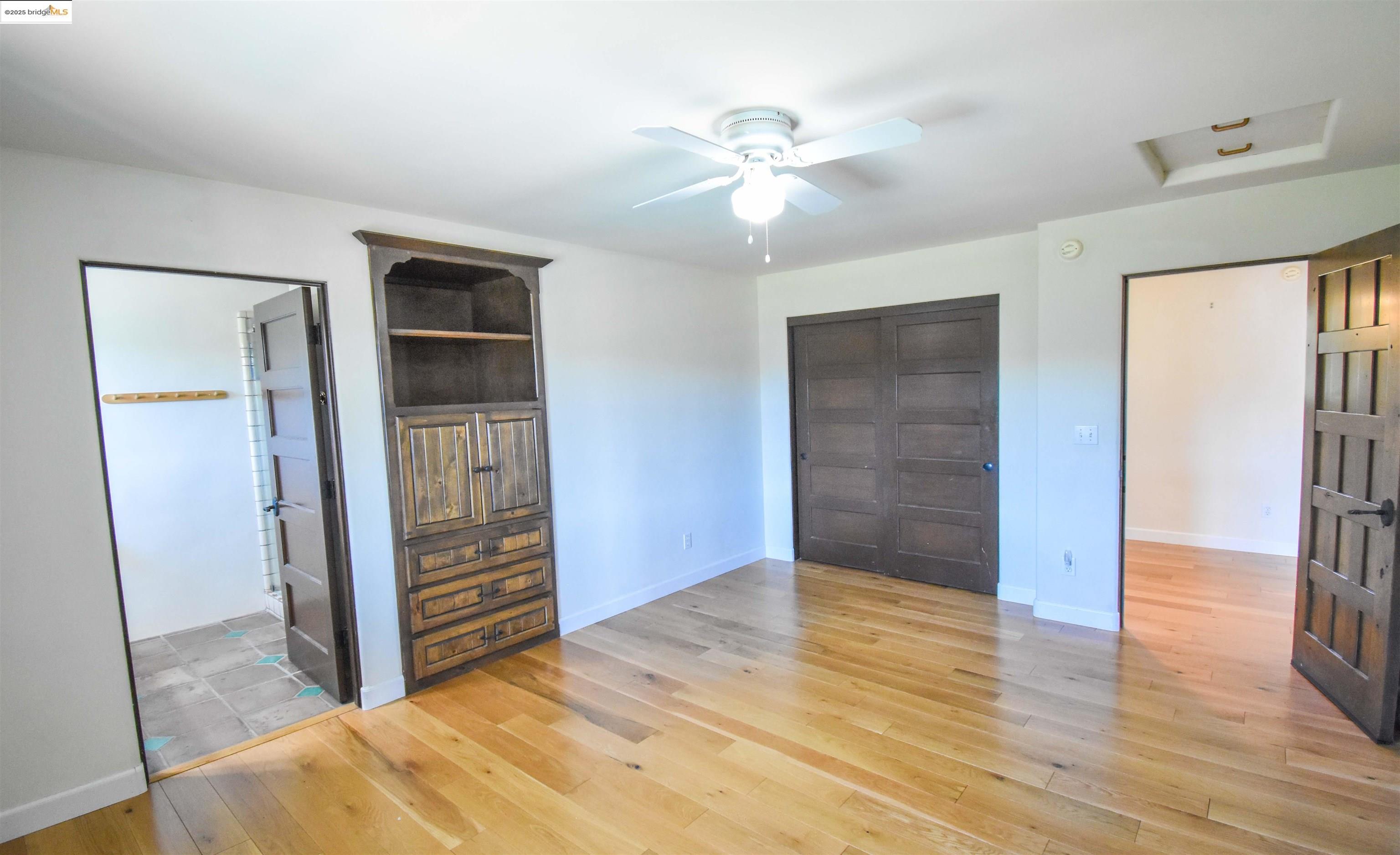 26255 Powell Ranch Road Sonora, CA 95370 - Photo 25 of 48 a view of livingroom with hardwood floor and ceiling fan
