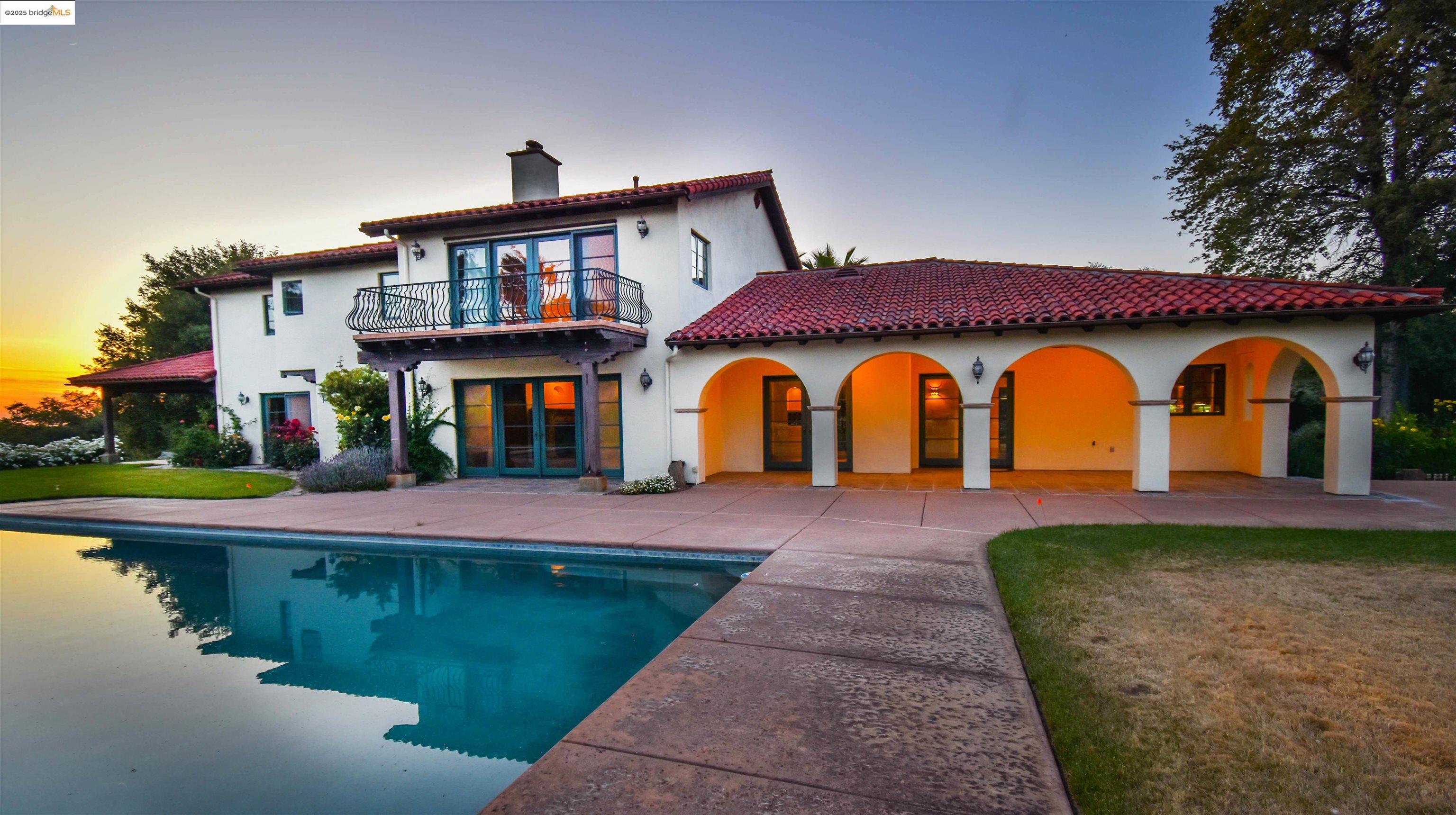 26255 Powell Ranch Road Sonora, CA 95370 - Photo 29 of 48 a front view of a house with swimming pool