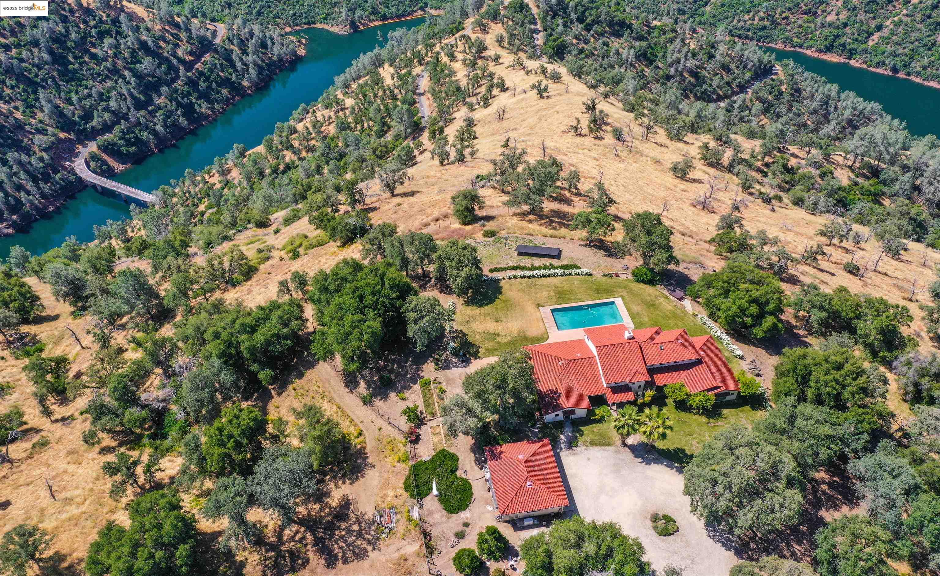 26255 Powell Ranch Road Sonora, CA 95370 - Photo 3 of 48 an aerial view of house with yard and swimming pool