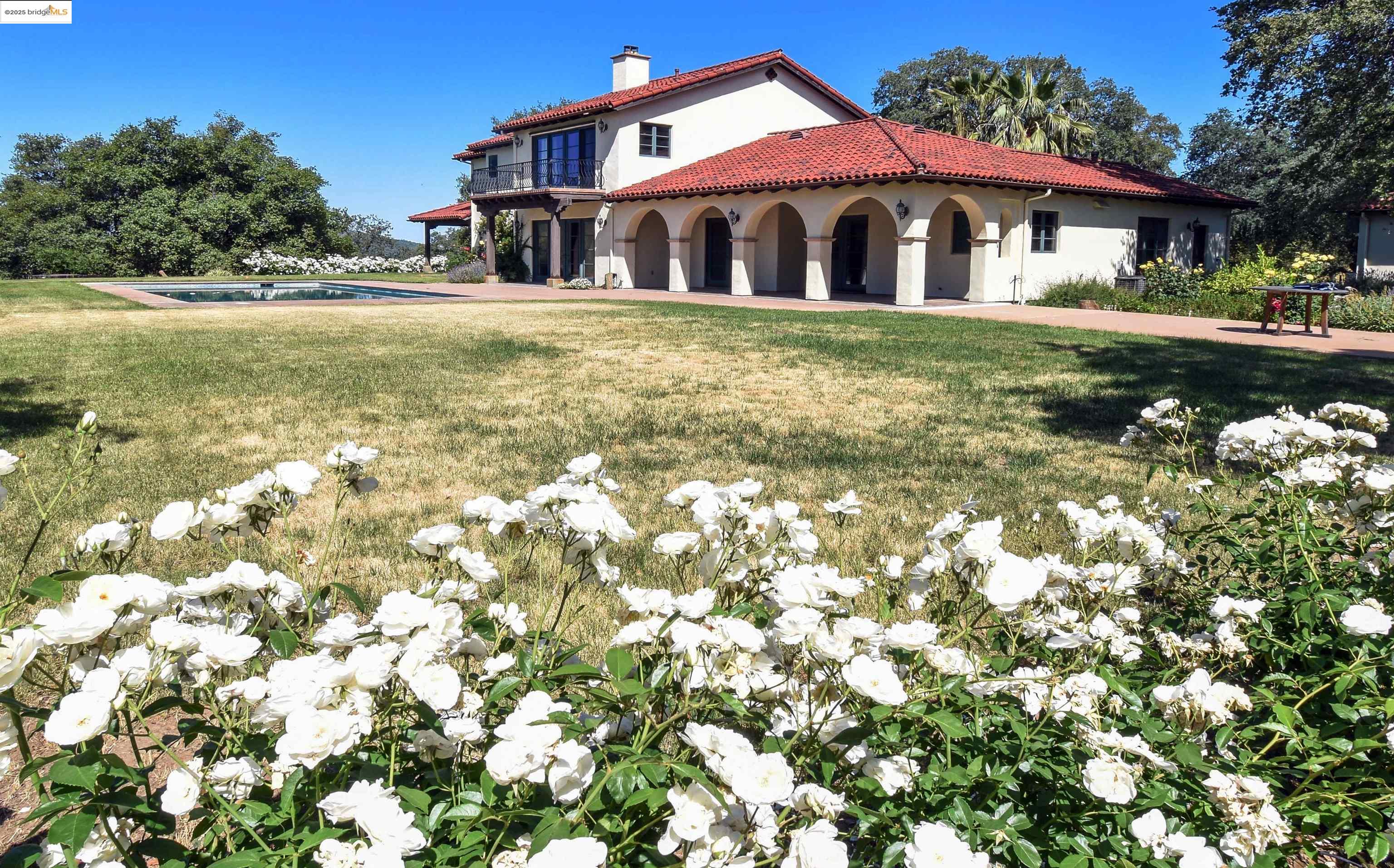 26255 Powell Ranch Road Sonora, CA 95370 - Photo 34 of 48 a front view of a house with garden