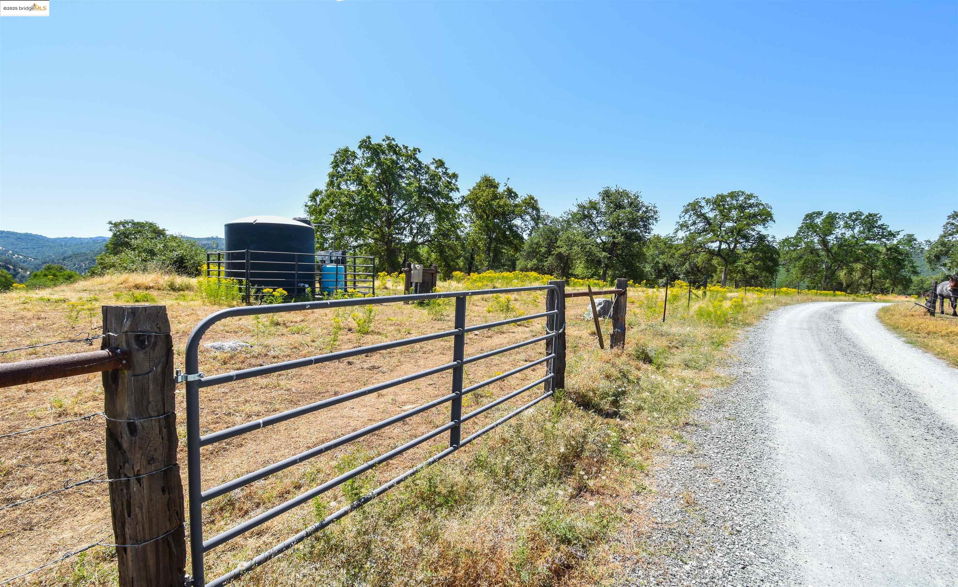 26255 Powell Ranch Road Sonora, CA 95370 - Photo 36 of 48 a view of a balcony with chairs