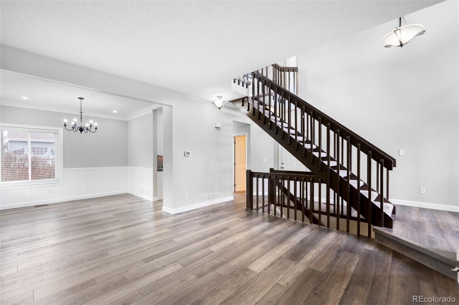 3618 West Rosewalk Circle Highlands Ranch, CO 80129 - Photo 5 of 45 a view of an entryway with wooden floor