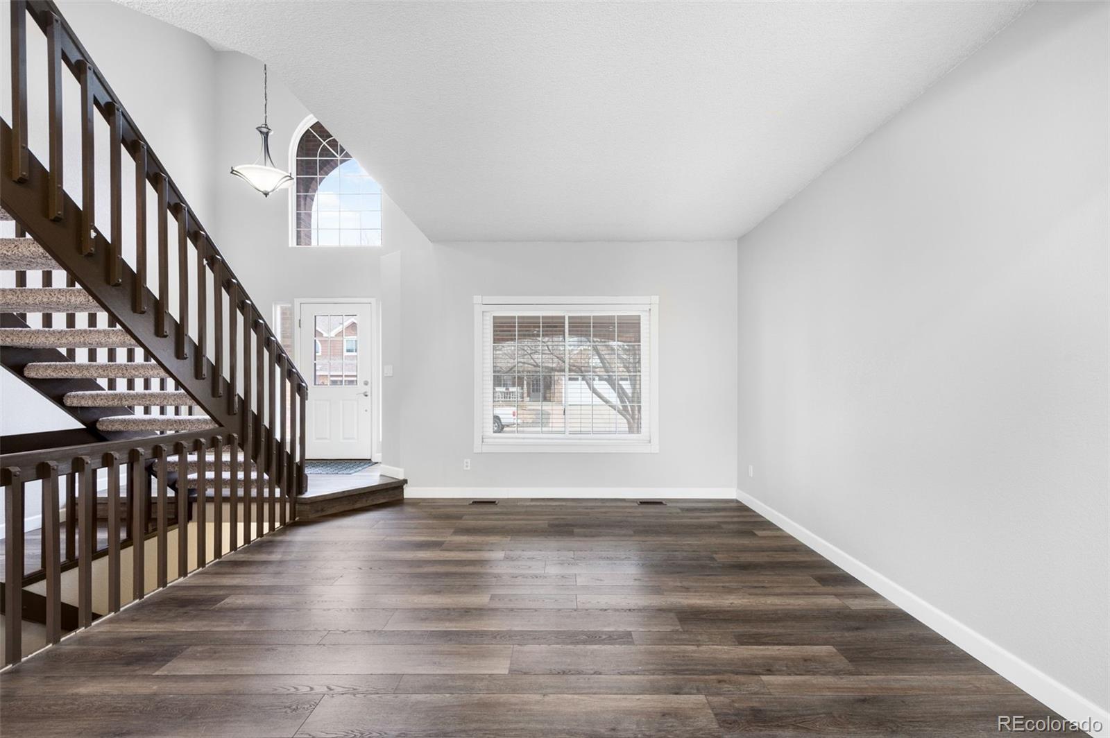3618 West Rosewalk Circle Highlands Ranch, CO 80129 - Photo 7 of 45 a view of an entryway with wooden floor