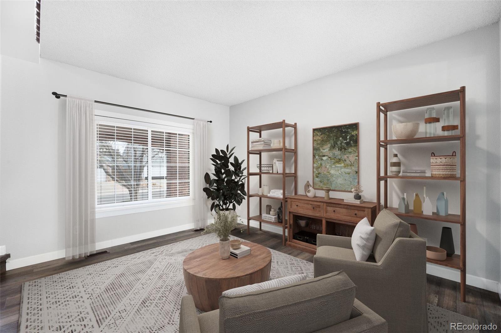 3618 West Rosewalk Circle Highlands Ranch, CO 80129 - Photo 9 of 45 a living room with furniture and a large window