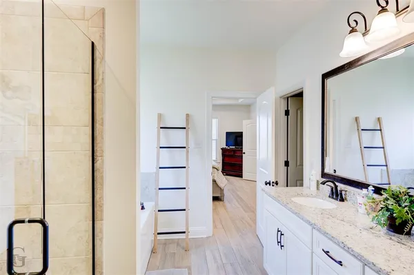 a view of a porch with furniture and a yard