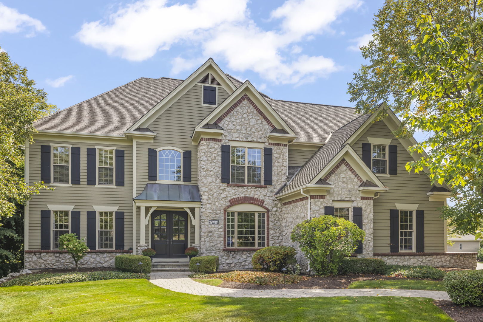 39W114 Fryendall Court Geneva, IL 60134 - Photo 2 of 76 a front view of a house with yard and porch