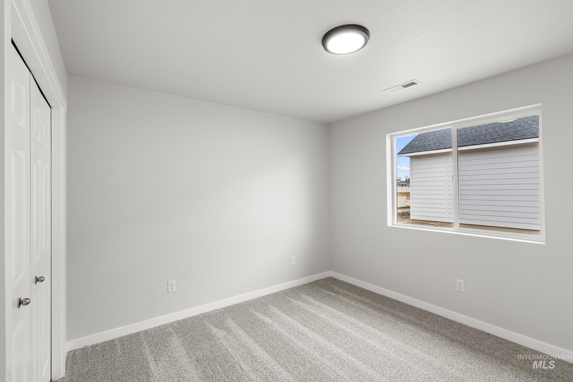511 Hamlow Avenue Middleton, ID 83644 - Photo 11 of 22 Unfurnished bedroom with a closet and light carpet