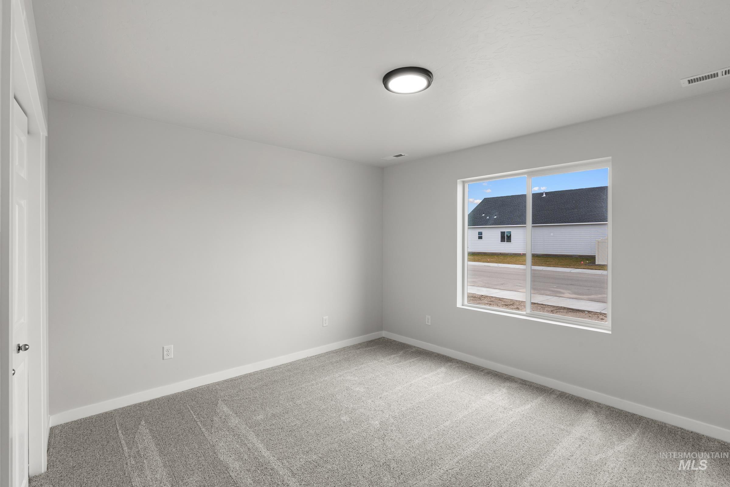 511 Hamlow Avenue Middleton, ID 83644 - Photo 14 of 22 Unfurnished room featuring light carpet