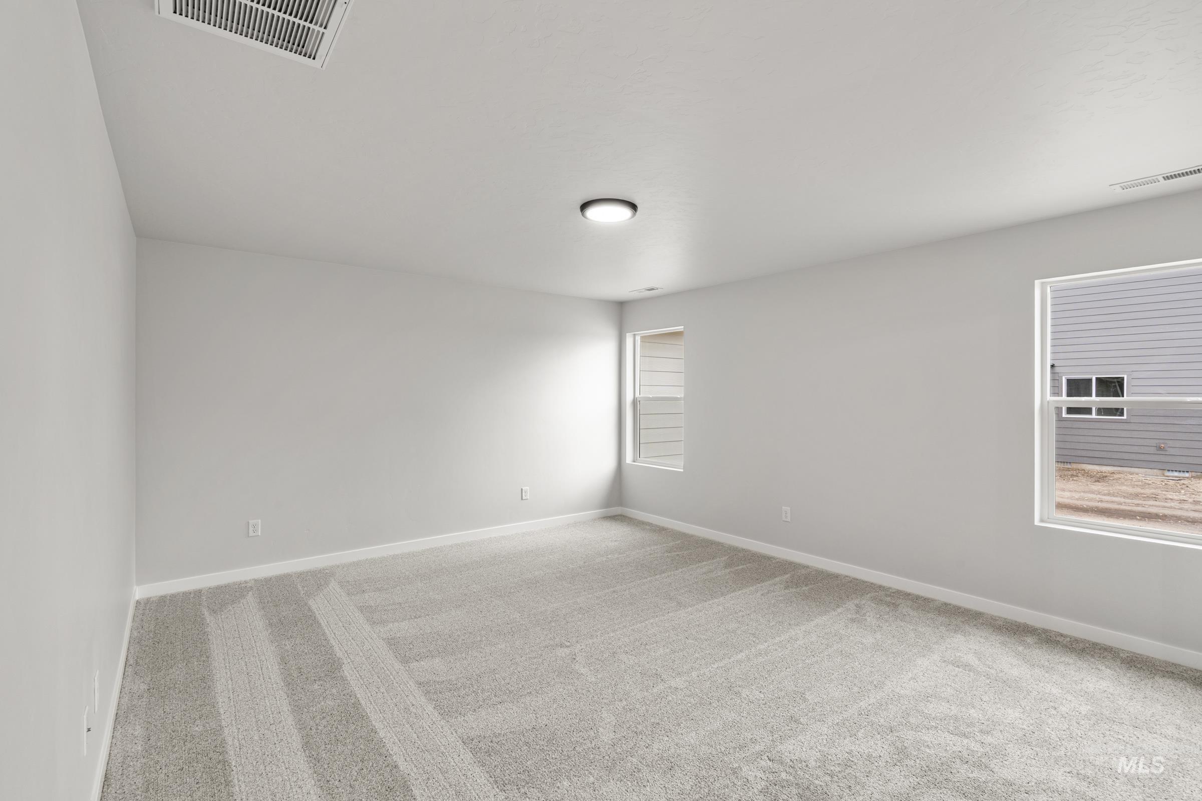 511 Hamlow Avenue Middleton, ID 83644 - Photo 15 of 22 Unfurnished room with light colored carpet and baseboards