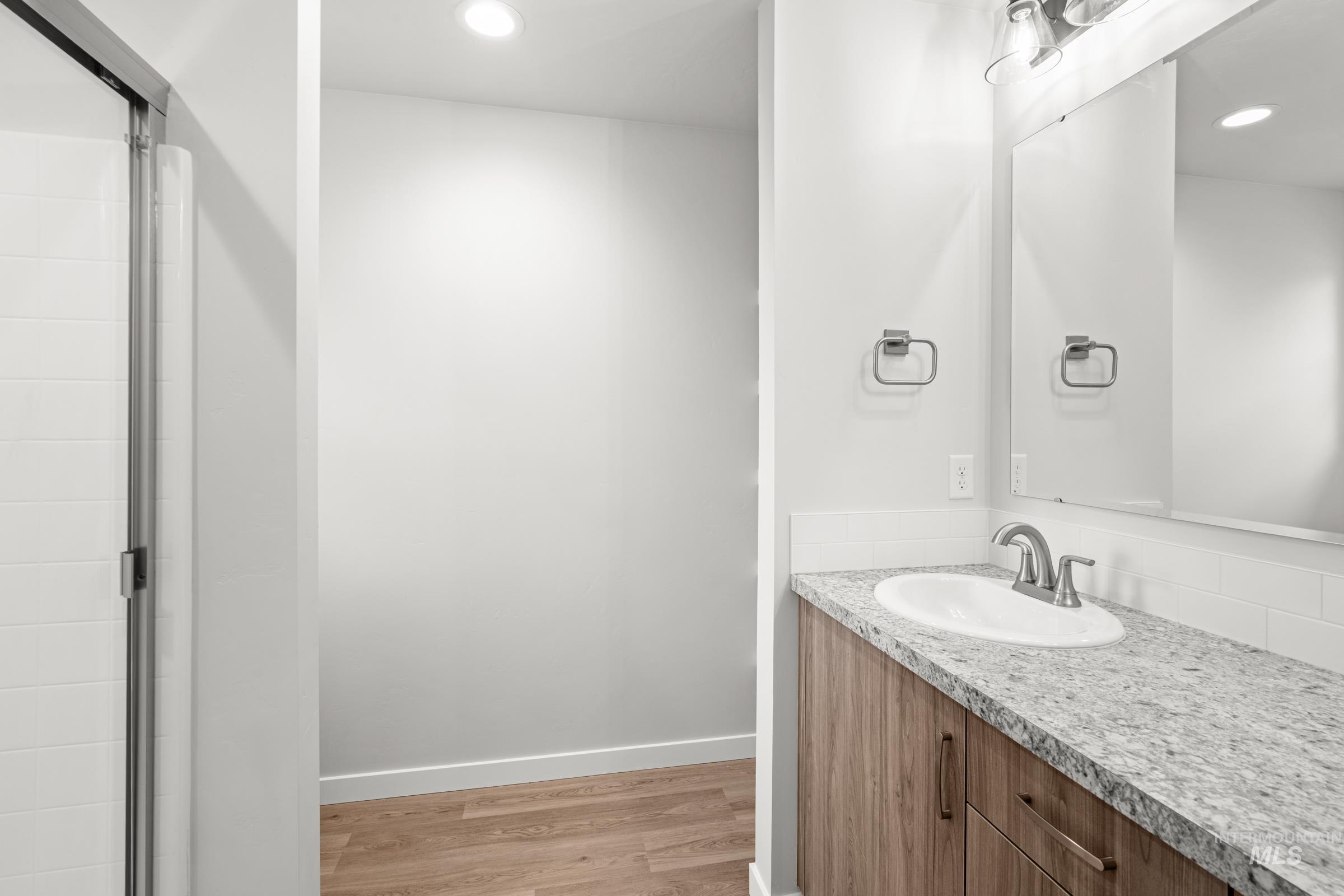 511 Hamlow Avenue Middleton, ID 83644 - Photo 19 of 22 Bathroom with light wood finished floors, recessed lighting, and vanity