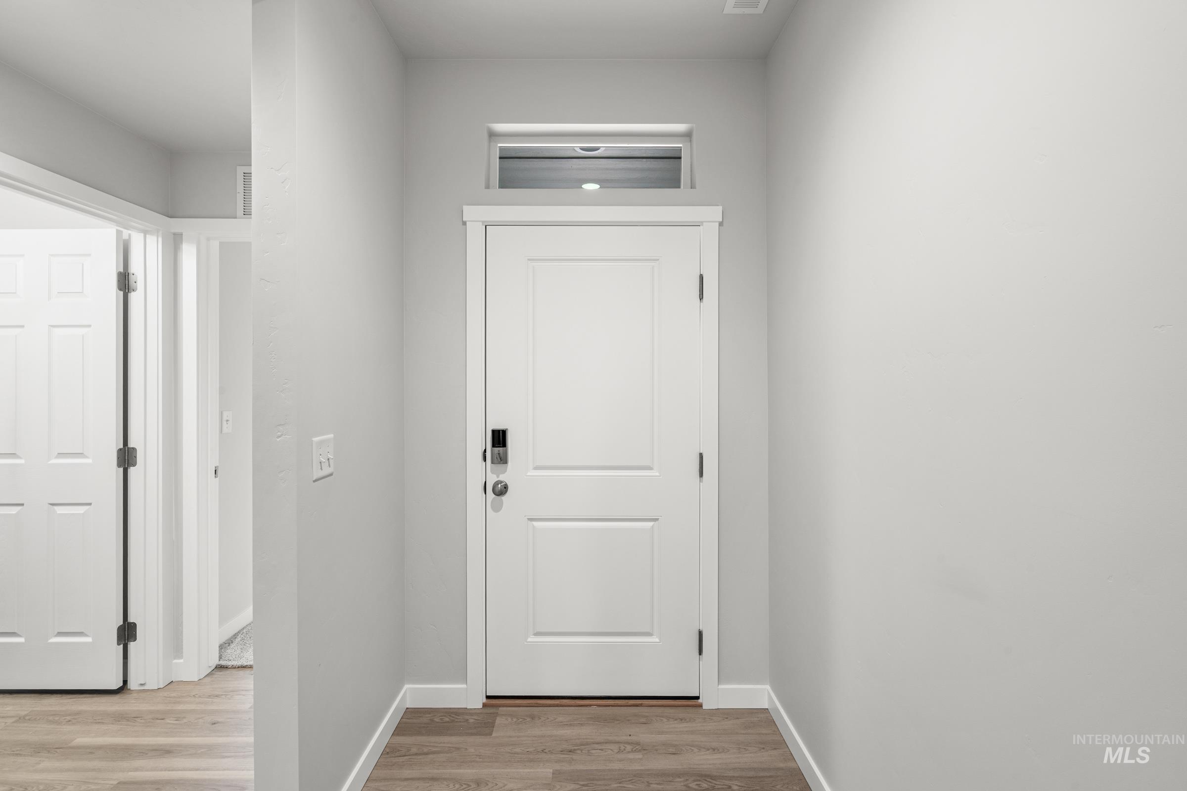 511 Hamlow Avenue Middleton, ID 83644 - Photo 2 of 22 Doorway to outside with wood finished floors and baseboards