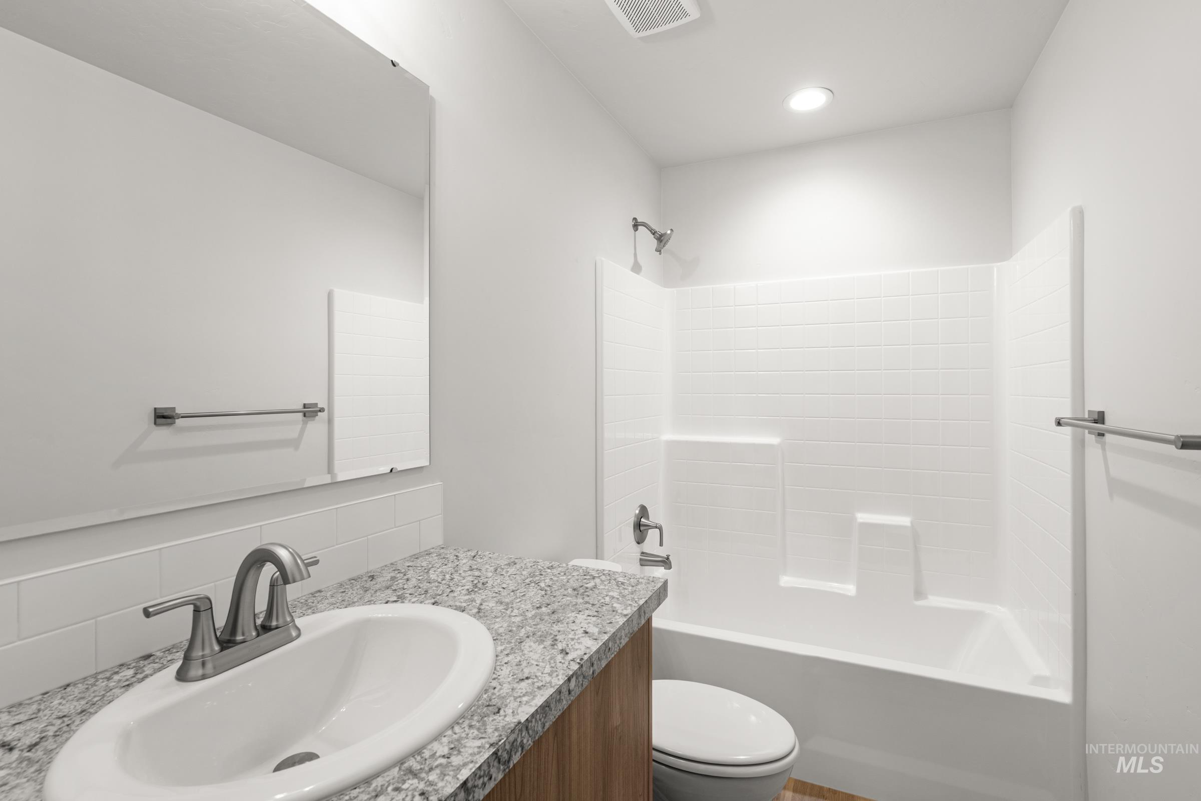 511 Hamlow Avenue Middleton, ID 83644 - Photo 22 of 22 Full bathroom with shower / bath combination, vanity, and decorative backsplash