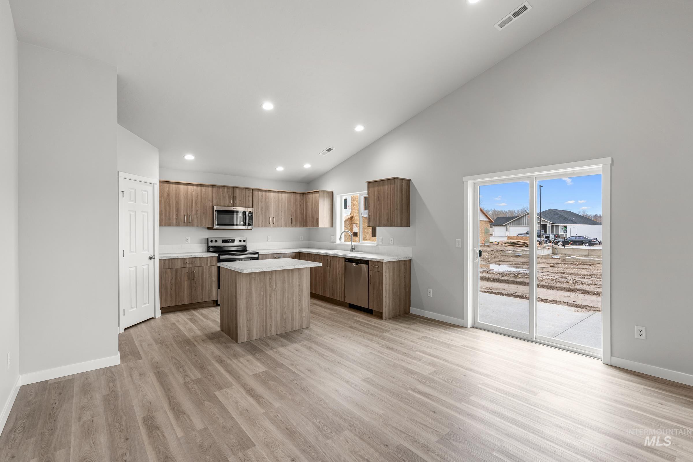 511 Hamlow Avenue Middleton, ID 83644 - Photo 3 of 22 Kitchen with a center island, stainless steel appliances, light wood-type flooring, recessed lighting, and modern cabinets