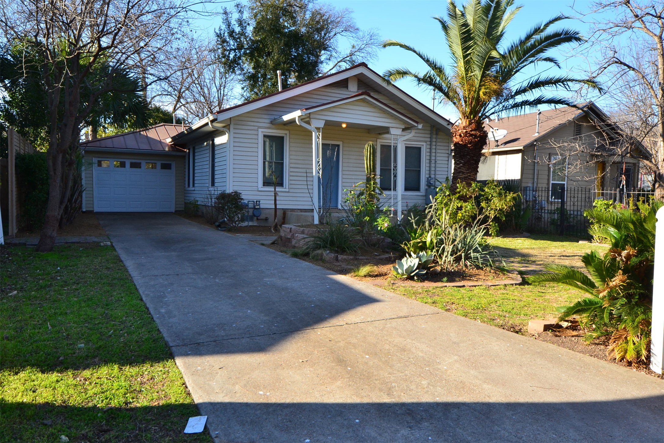 7602 Blessing Avenue Austin, TX 78752 - Photo 1 of 1 a front view of a house with garden