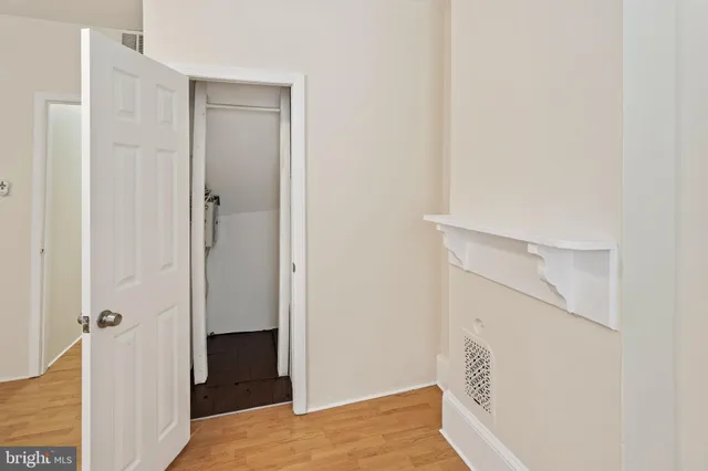 a view of hallway with wooden floor