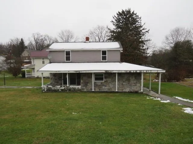 a view of a tree in front of a house