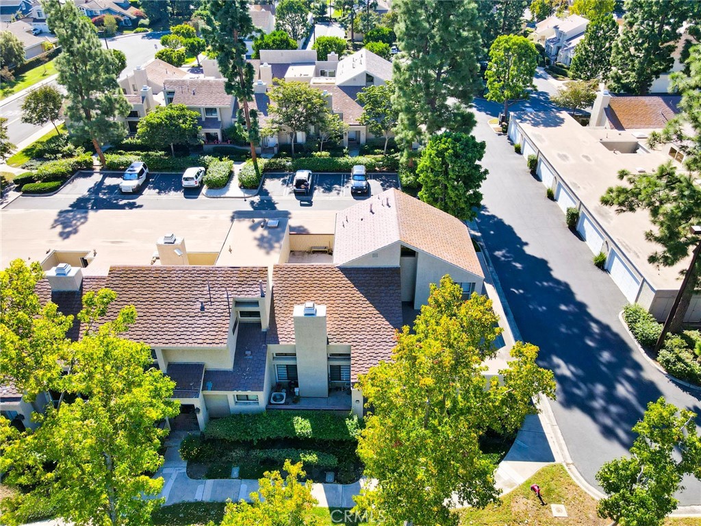 an aerial view of a house with a yard and garden