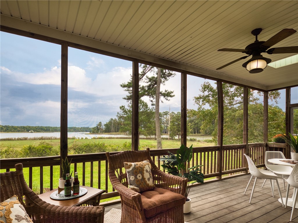 7914 O Neil Road Gloucester, VA 23061 - Photo 40 of 47 Sunroom featuring ceiling fan and a deck with water view