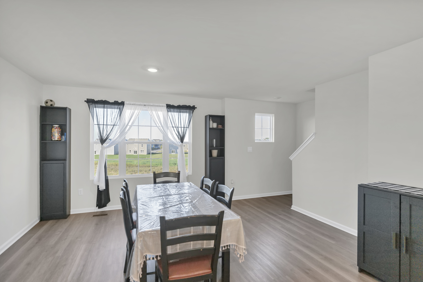 1464 Sequoia Way Hampshire, IL 60140 - Photo 11 of 31 a view of a dining room with furniture window and wooden floor
