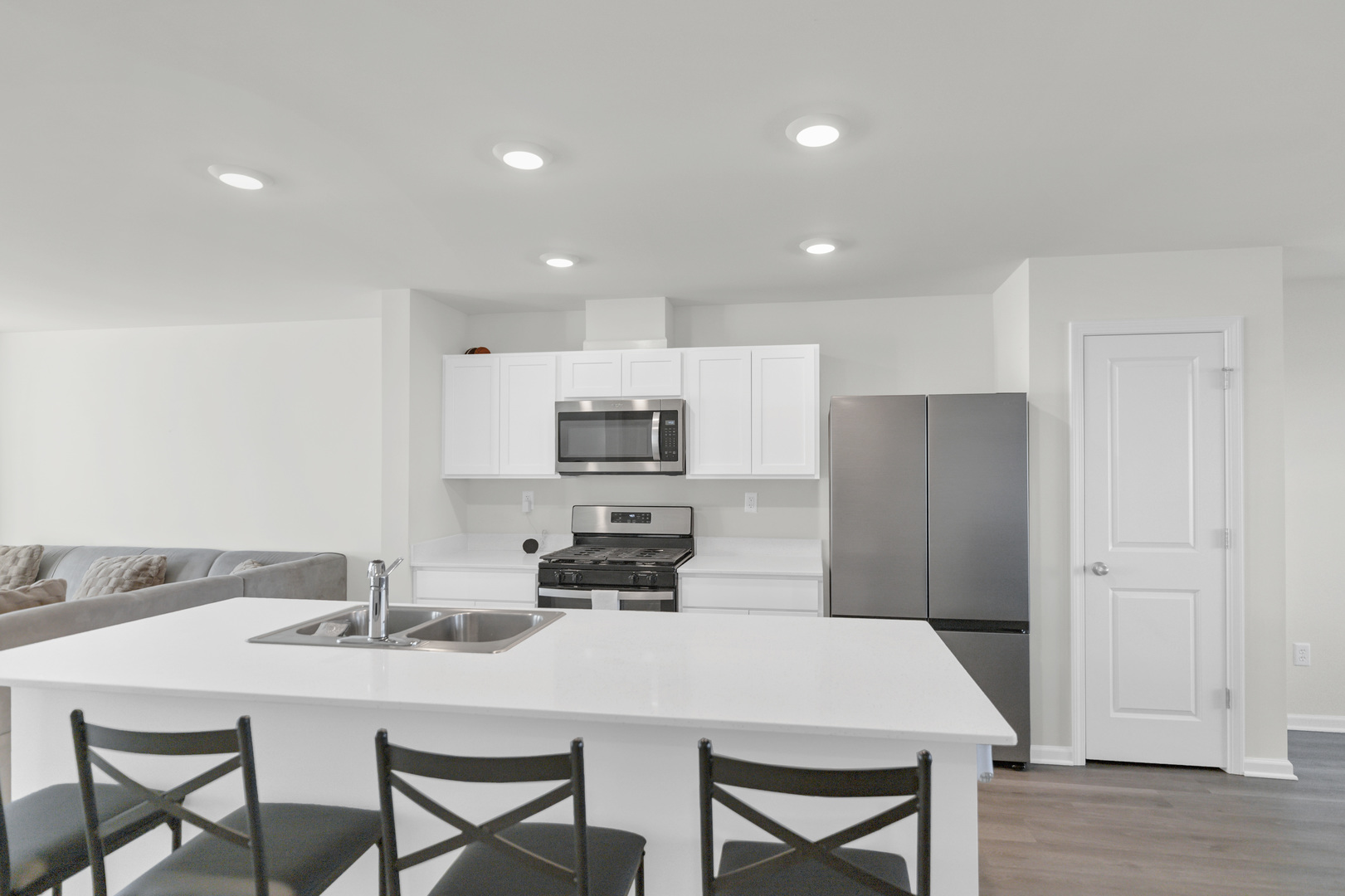 1464 Sequoia Way Hampshire, IL 60140 - Photo 13 of 31 a kitchen with stainless steel appliances a table and chairs in it