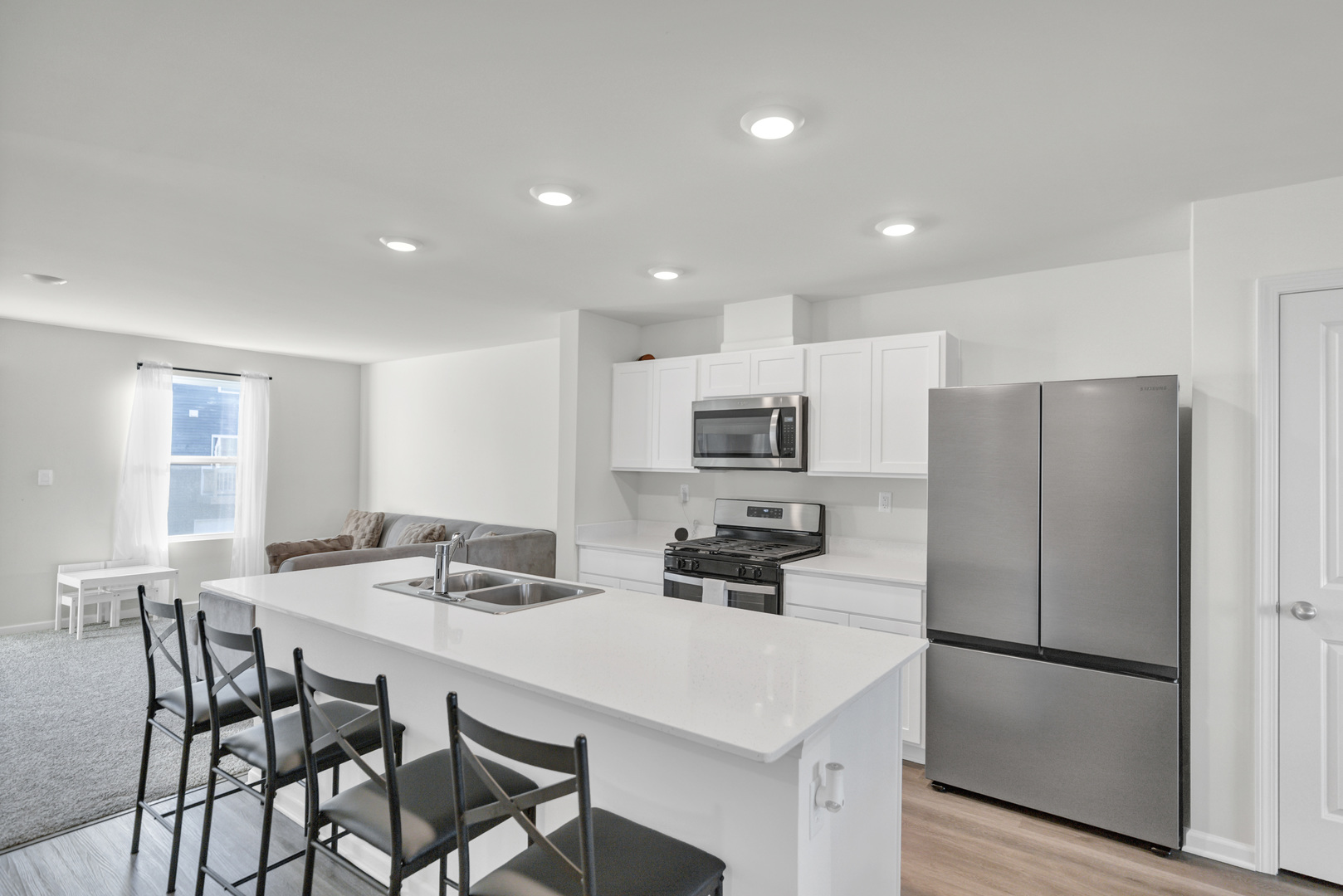 1464 Sequoia Way Hampshire, IL 60140 - Photo 14 of 31 a kitchen that has a refrigerator a table and chairs in it