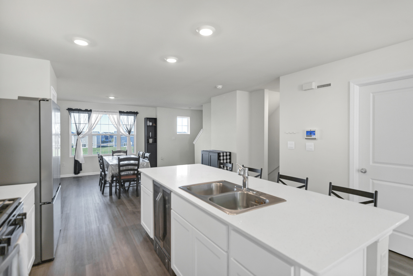 1464 Sequoia Way Hampshire, IL 60140 - Photo 16 of 31 a kitchen with a table chairs stove and refrigerator