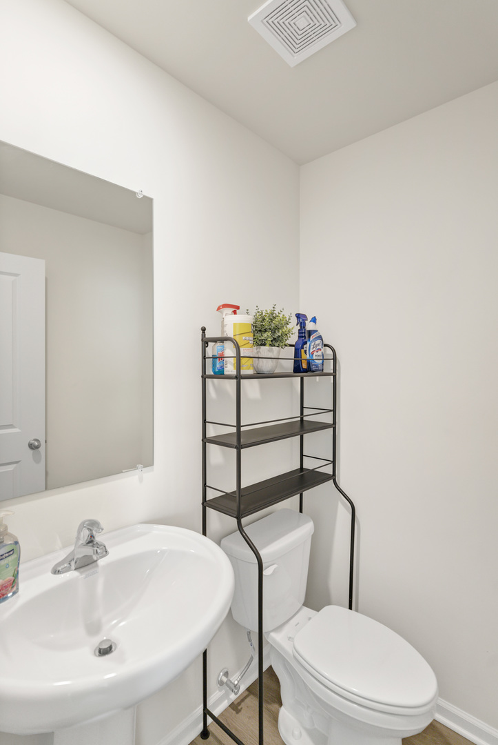 1464 Sequoia Way Hampshire, IL 60140 - Photo 17 of 31 a bathroom with a toilet sink and mirror