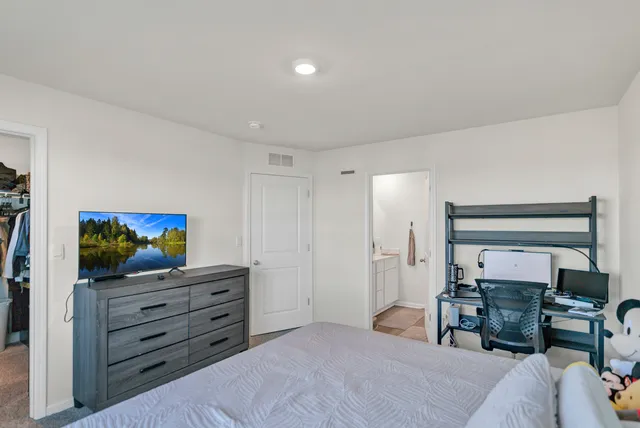 a bedroom with a bed and furniture