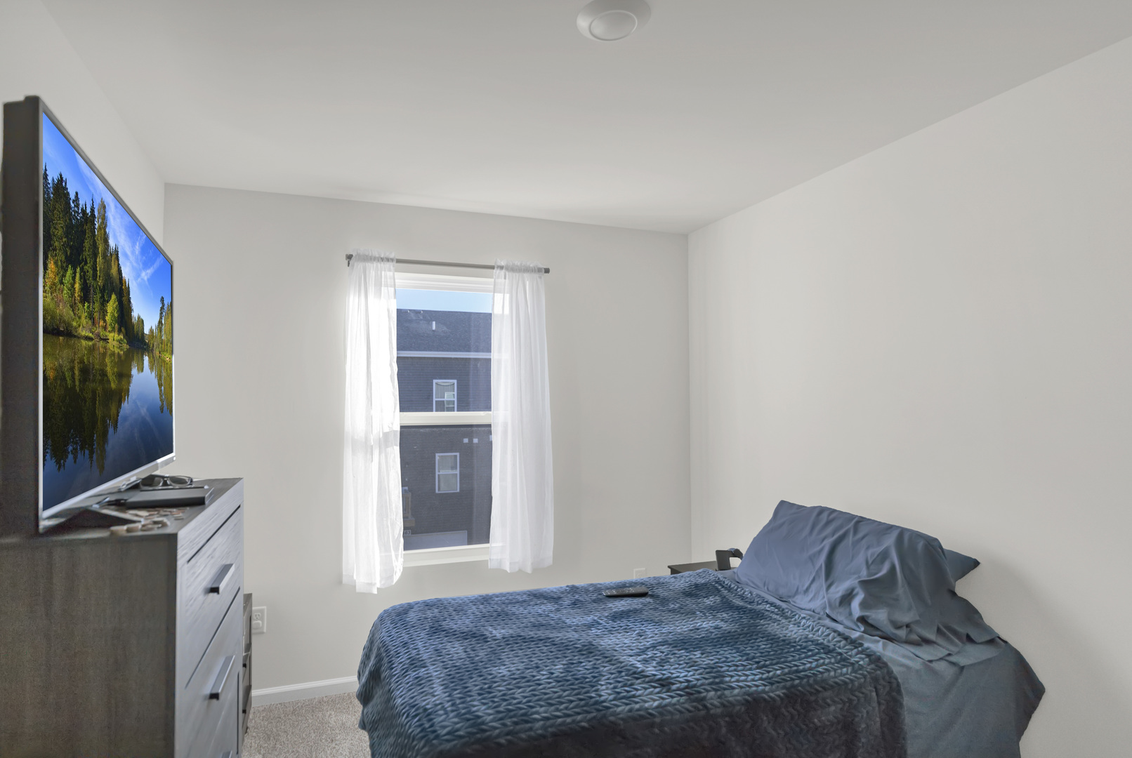 1464 Sequoia Way Hampshire, IL 60140 - Photo 23 of 31 a bedroom with a bed and a flat screen tv