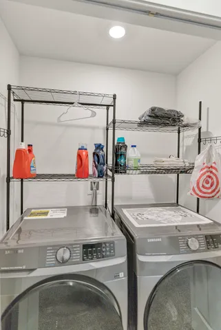 a utility room with washer and dryer