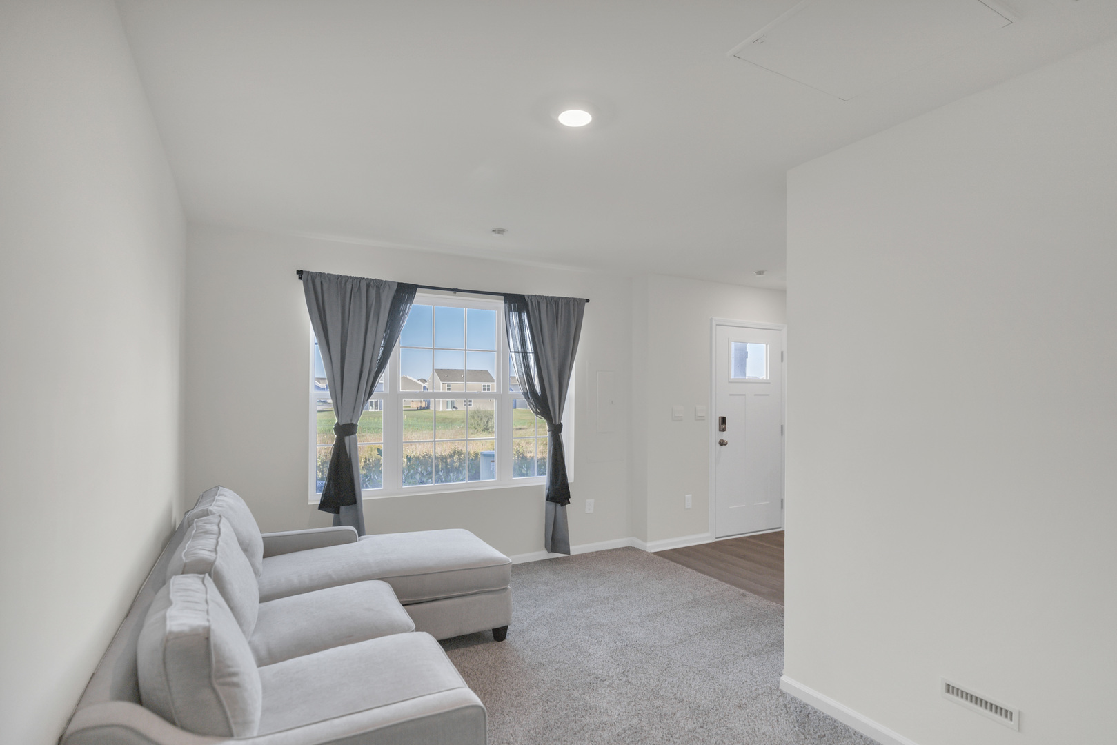 1464 Sequoia Way Hampshire, IL 60140 - Photo 30 of 31 a living room with furniture and a large window