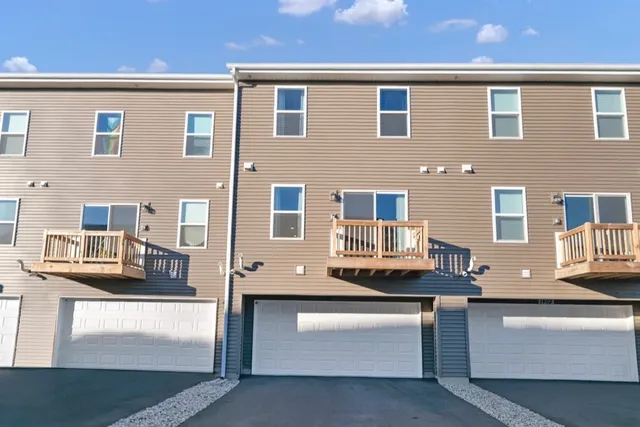 a front view of a house with a garage