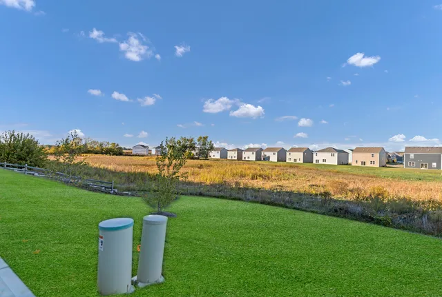 a view of a house with a big yard