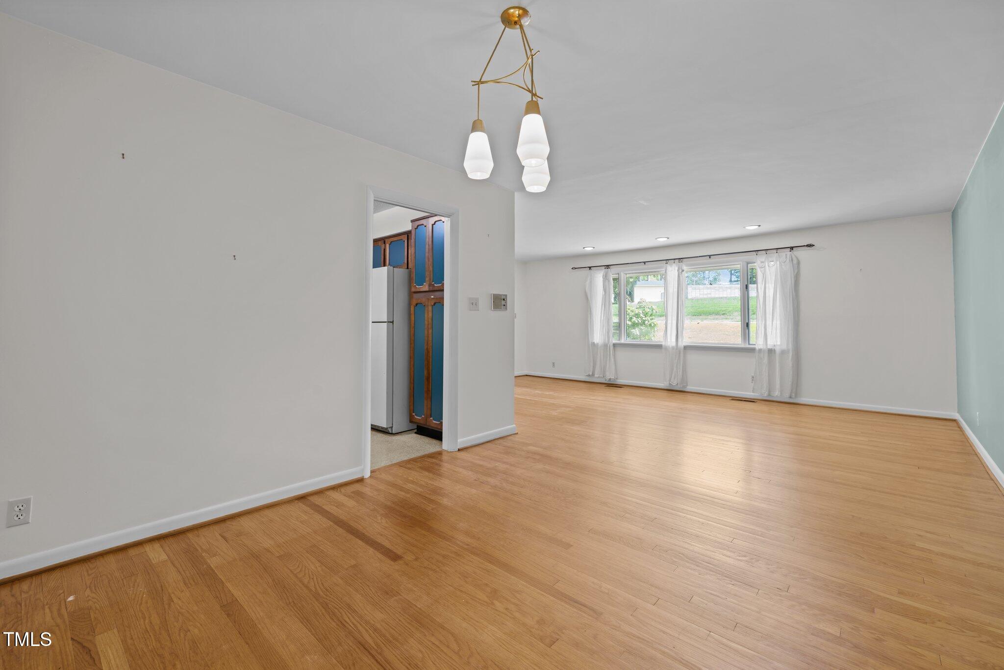 1024 Chalmers Street Durham, NC 27707 - Photo 10 of 41 a view of an empty room with a window