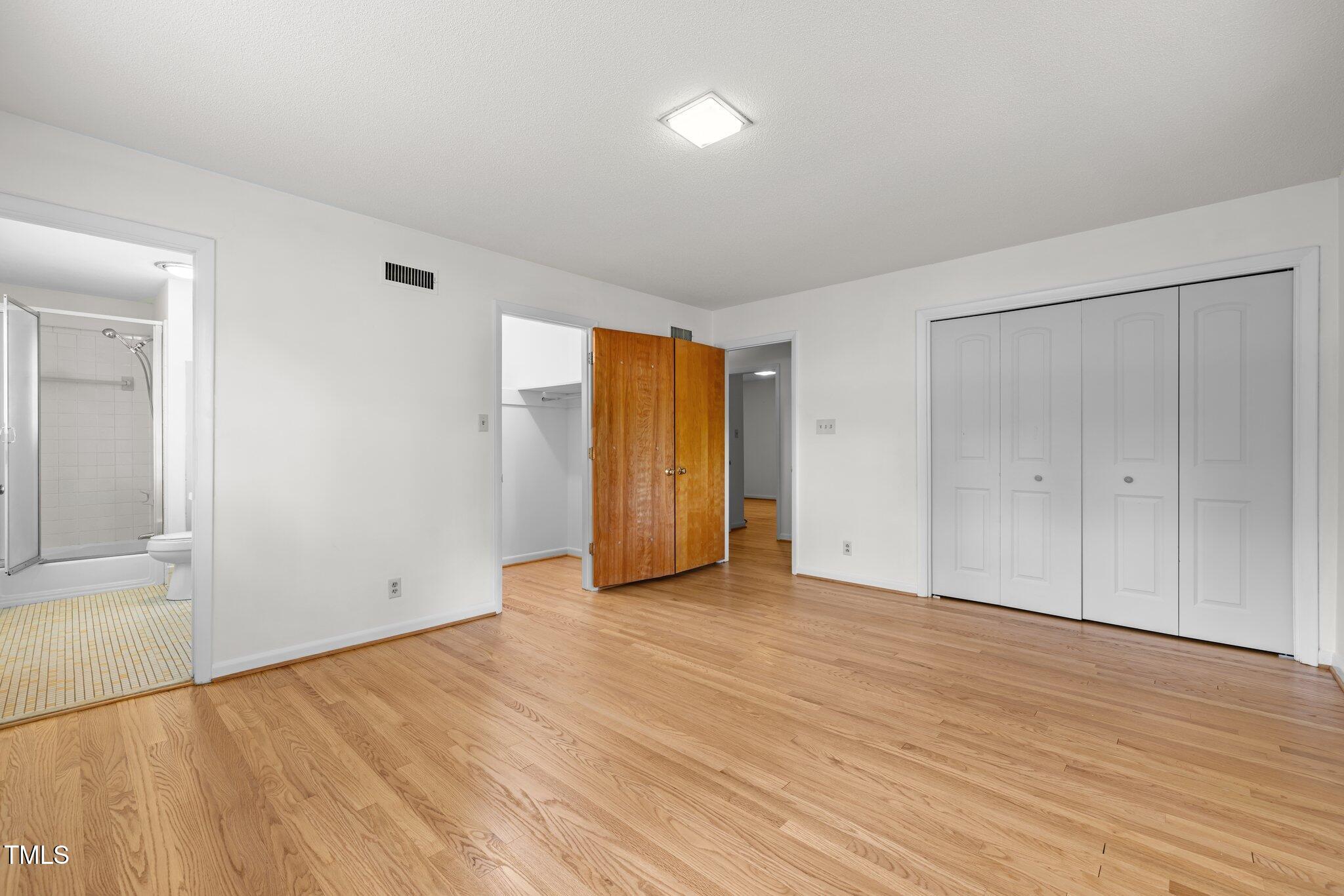 1024 Chalmers Street Durham, NC 27707 - Photo 27 of 41 a view of an empty room with wooden floor